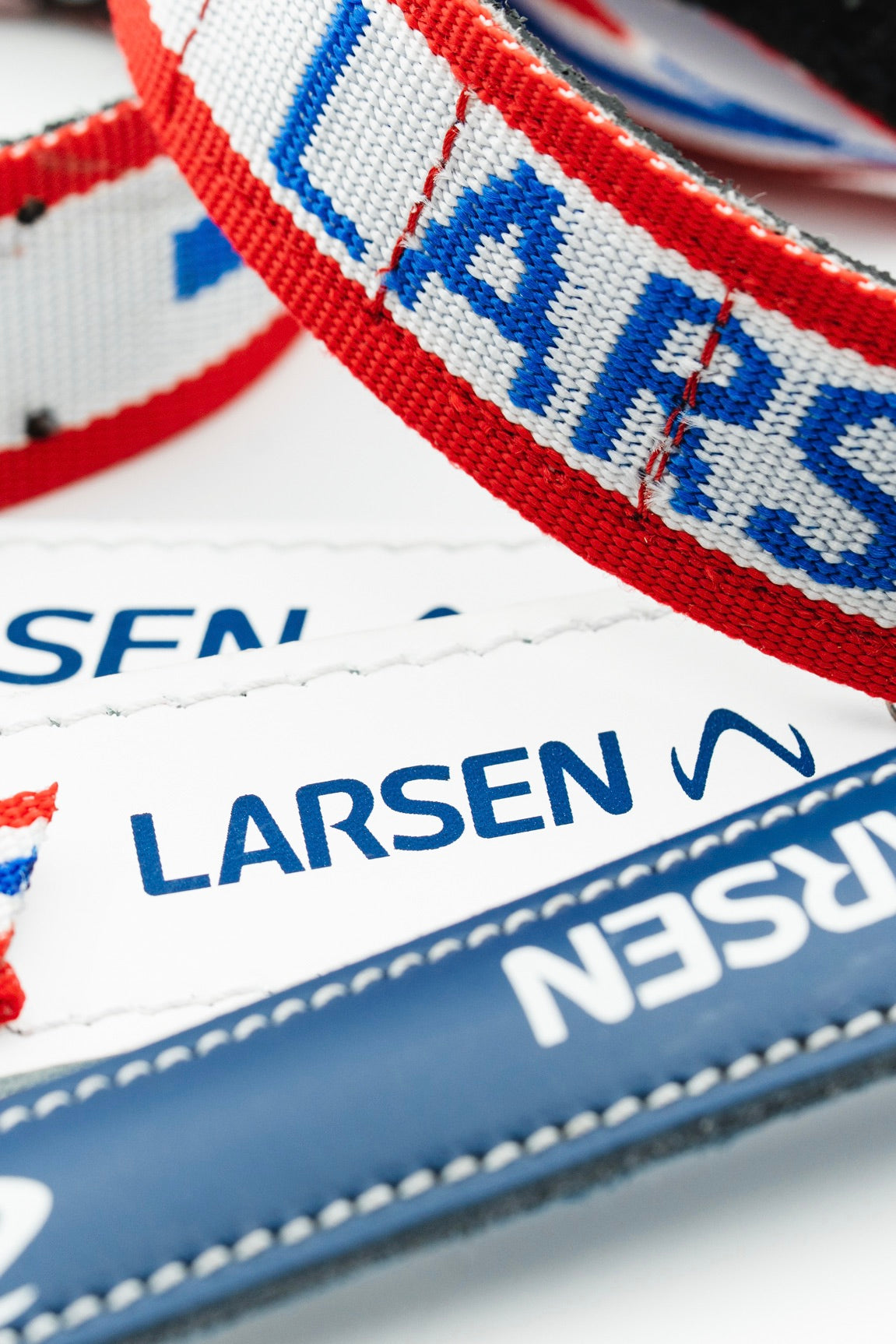 Collection of Larsen biathlon arm cuffs, slings, and harnesses in close up view