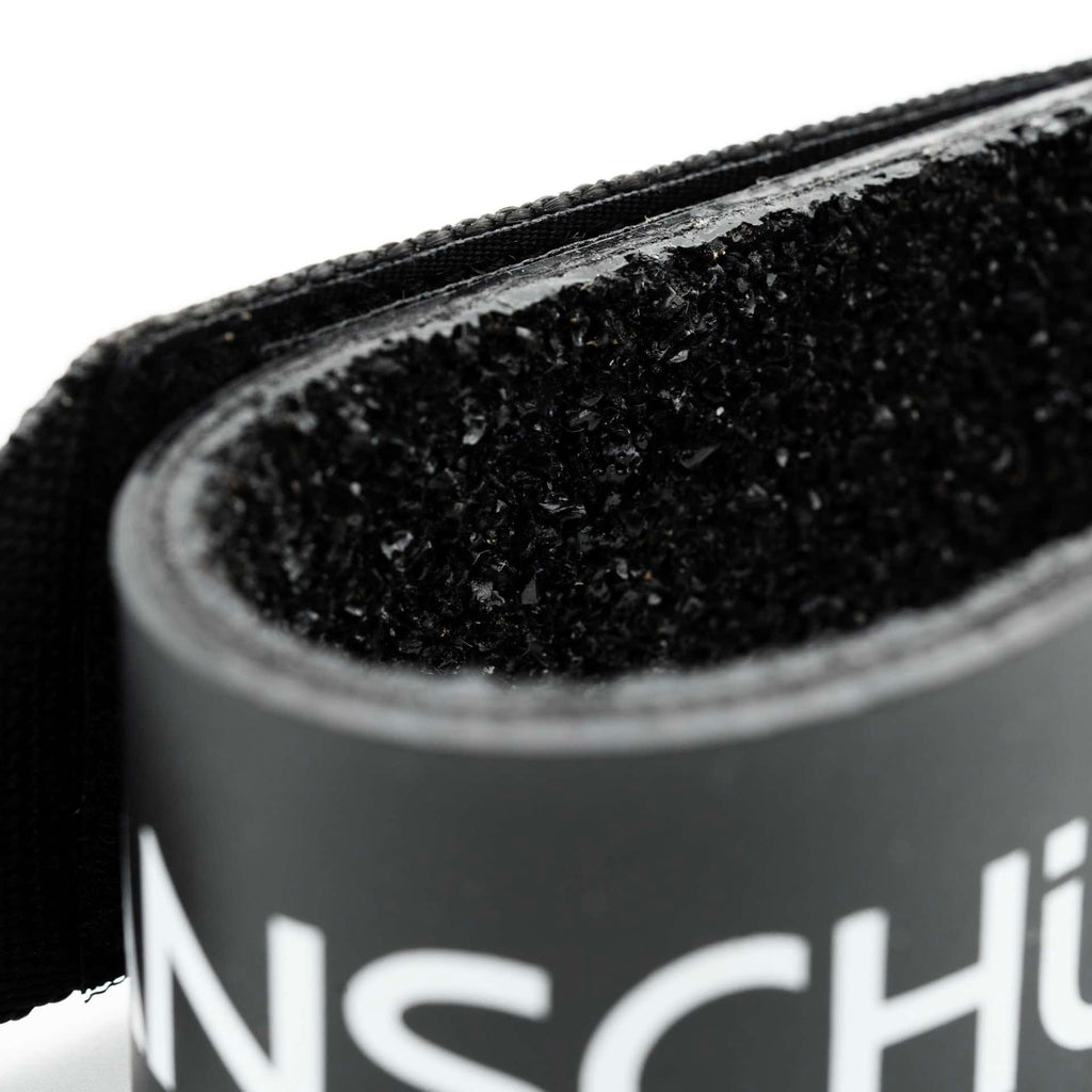 Anschutz biathlon arm cuff 4734 in black in close up view of rubber anti-slip coating