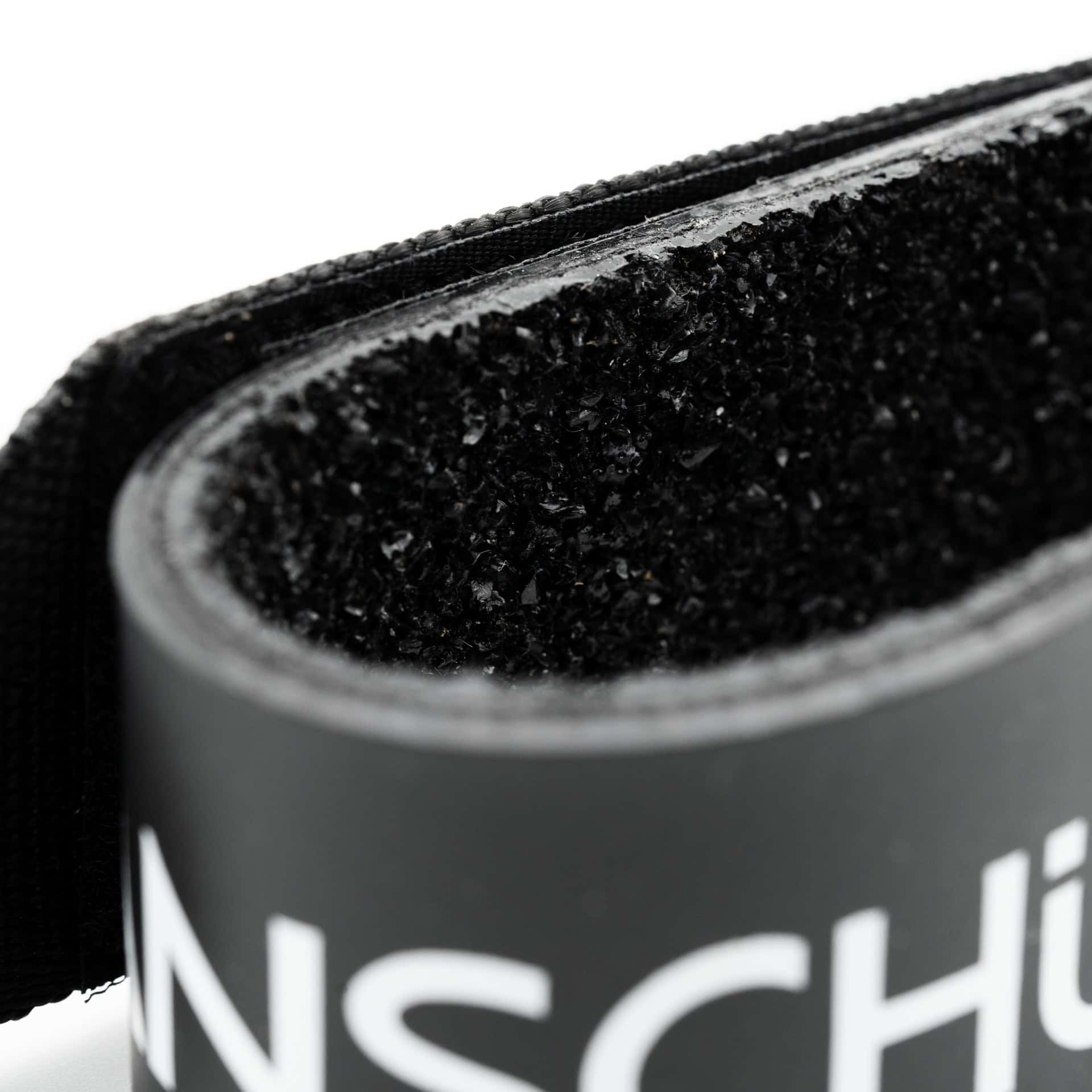 Anschutz biathlon arm cuff 4734 in black in close up view of rubber anti-slip coating
