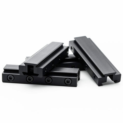 Fortner 8mm rear sight risers for Anschutz 1827F biathlon rifles piled in multiple orientations
