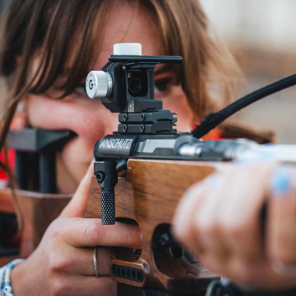 Athlete using a Gehmann 590-B Biathlon Rear Sight on an Anschutz 1827F Fortner biathlon rifle.