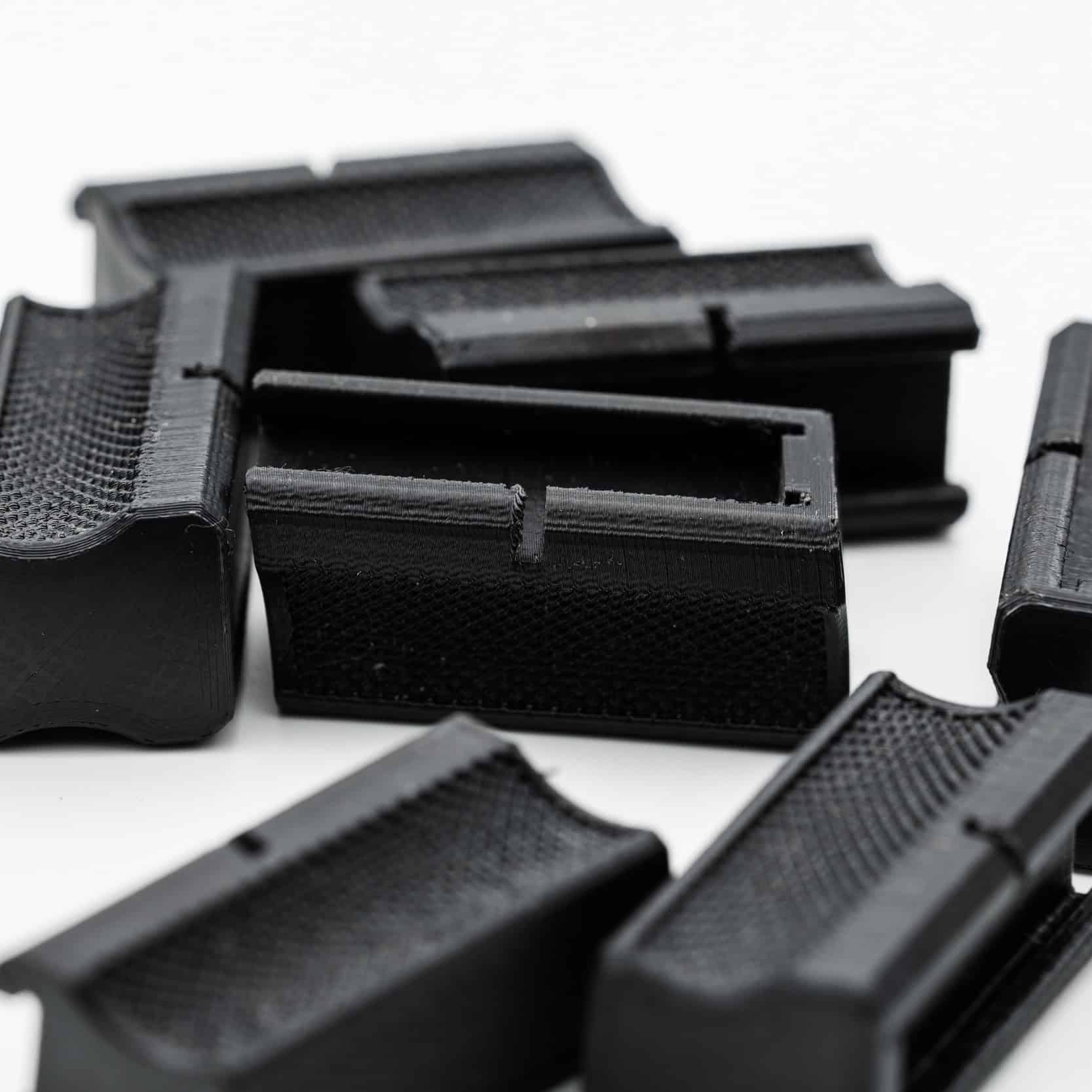 Magazine floor plate for Anschutz 1827F biathlon short magazines, multiple bottom views