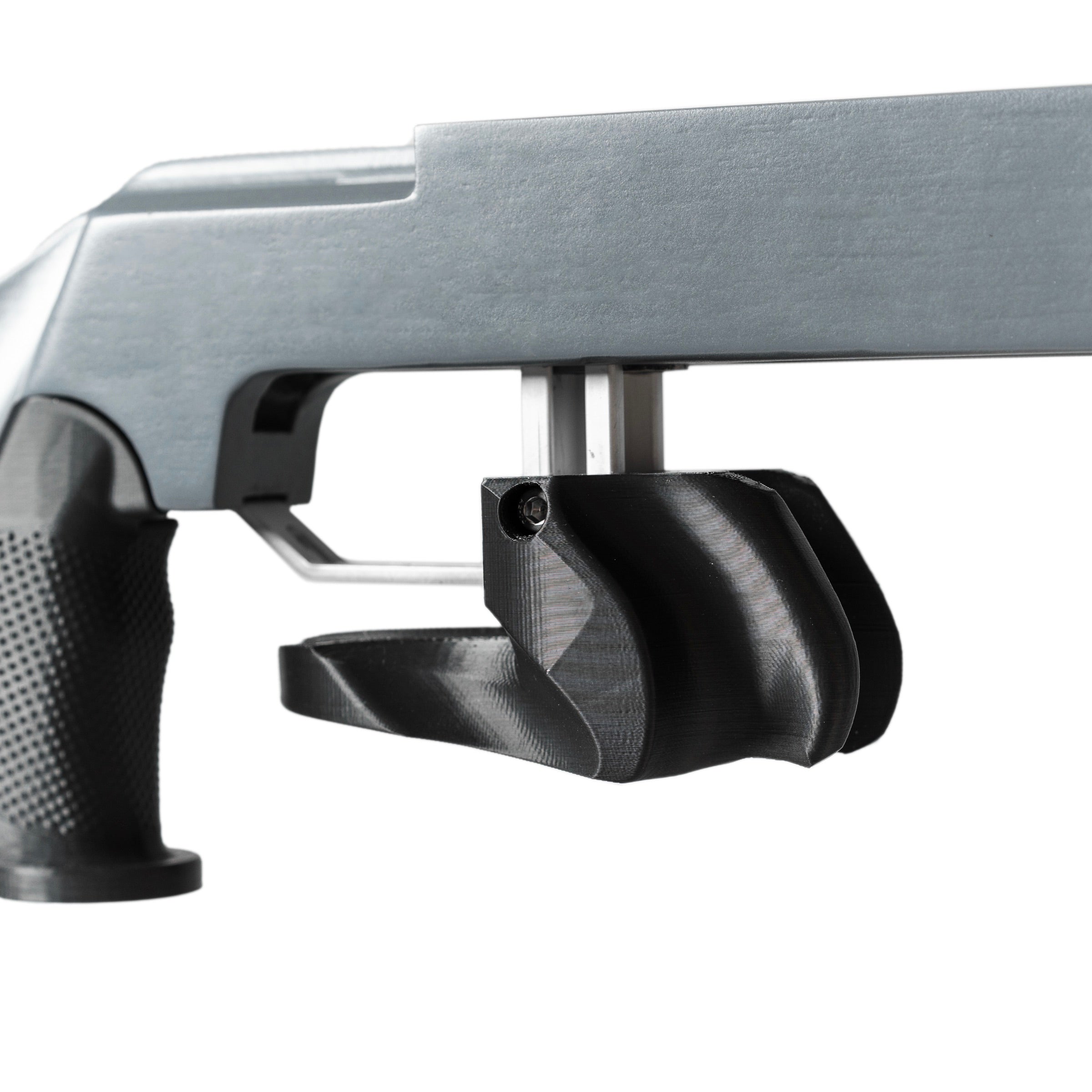 Close-up of a Naylor 2 biathlon stock with a focus on the standing grip and trigger area on a white background